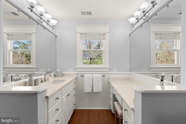 3915 Aspen St, Chevy Chase, MD 20815 - bathroom featuring wainscoting, vanity, wood finished floors, and visible vents