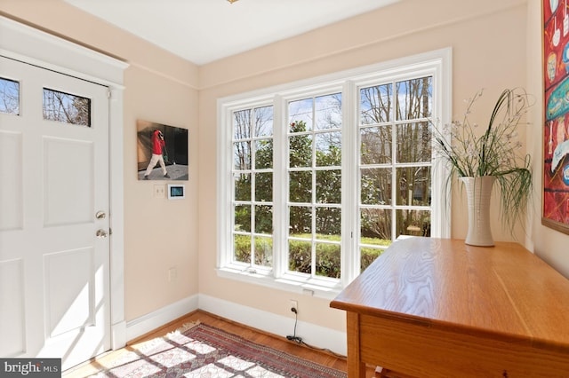 3915 Aspen St, Chevy Chase, MD 20815 - doorway to outside featuring wood finished floors and baseboards