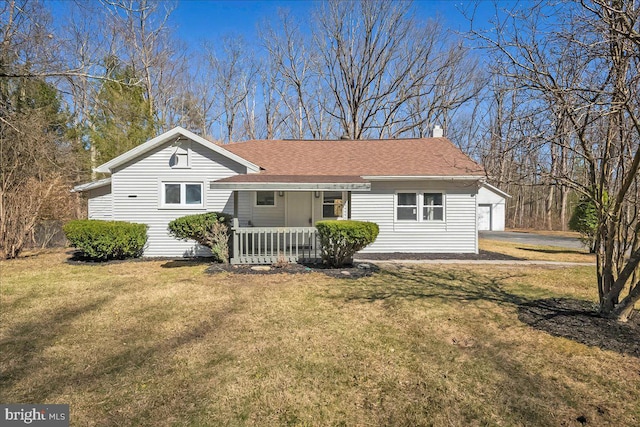 696 Burger Hollow Rd, Kunkletown, PA 18058 - back of property featuring a shingled roof, an outbuilding, covered porch, and a yard