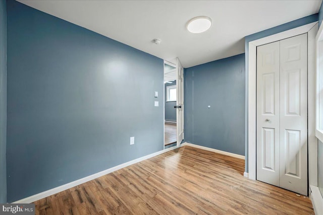 696 Burger Hollow Rd, Kunkletown, PA 18058 - unfurnished bedroom featuring wood finished floors, a closet, and baseboards