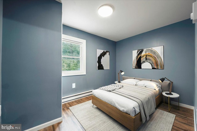 696 Burger Hollow Rd, Kunkletown, PA 18058 - bedroom with a baseboard heating unit, baseboards, and wood finished floors