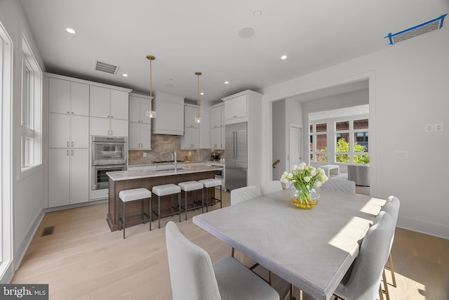 227 S Union St, Alexandria, VA 22314 - dining room featuring recessed lighting, baseboards, light wood finished floors, and visible vents