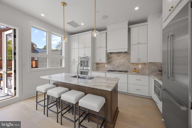 227 S Union St, Alexandria, VA 22314 - kitchen with a sink, built in appliances, recessed lighting, backsplash, and visible vents