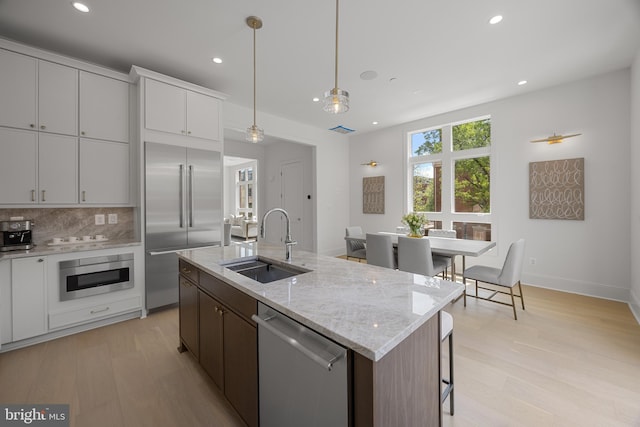 227 S Union St, Alexandria, VA 22314 - kitchen featuring recessed lighting, a sink, backsplash, and stainless steel appliances