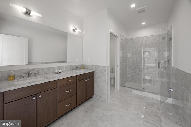 227 S Union St, Alexandria, VA 22314 - full bathroom with a sink, a stall shower, toilet, and tile walls