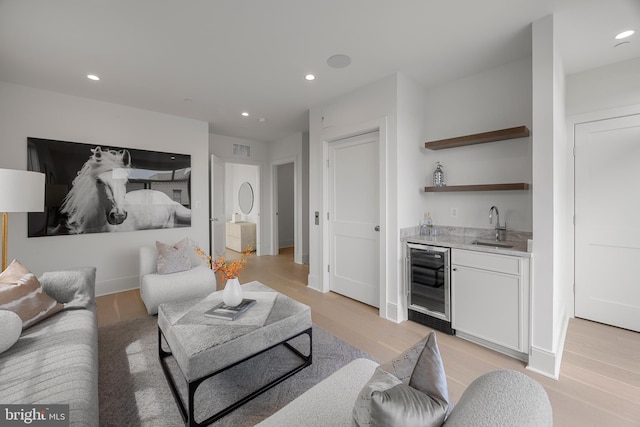 227 S Union St, Alexandria, VA 22314 - living area featuring wet bar, visible vents, light wood-type flooring, beverage cooler, and recessed lighting