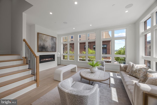 227 S Union St, Alexandria, VA 22314 - living room with a glass covered fireplace, stairway, recessed lighting, and wood finished floors