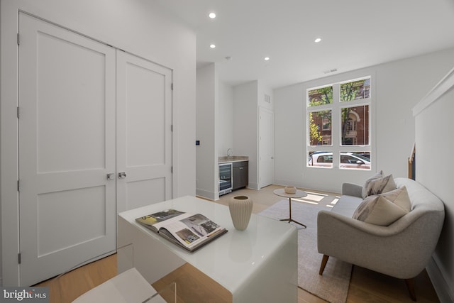 227 S Union St, Alexandria, VA 22314 - living area featuring recessed lighting, light wood finished floors, beverage cooler, and visible vents