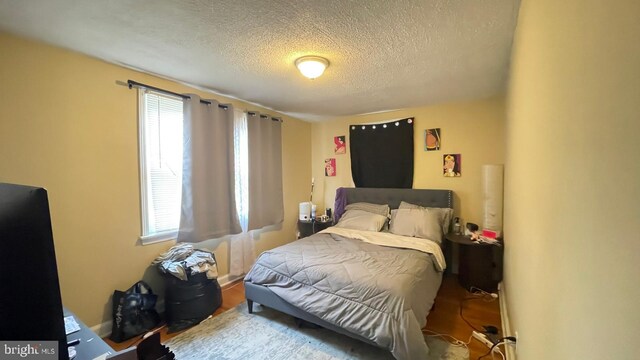 bedroom featuring a textured ceiling