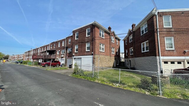 view of building exterior featuring fence