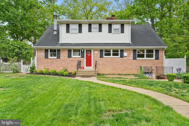 traditional-style home with fence, a chimney, and a front lawn