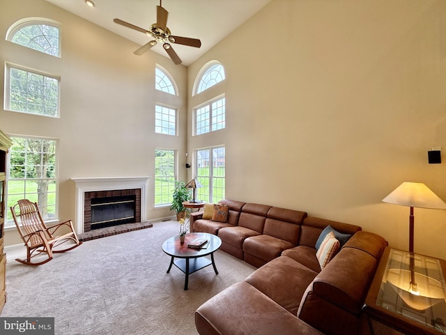 14100 Twisting Ln, Dayton, MD 21036 - living room featuring plenty of natural light, carpet floors, high vaulted ceiling, a brick fireplace, and ceiling fan