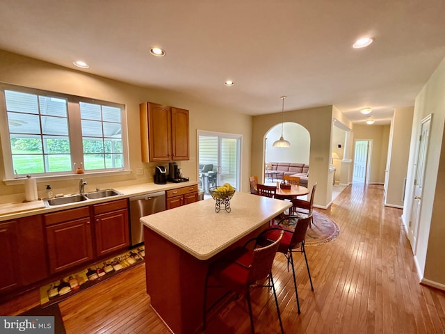 14100 Twisting Ln, Dayton, MD 21036 - kitchen featuring dishwasher, a sink, light countertops, a center island, and healthy amount of natural light