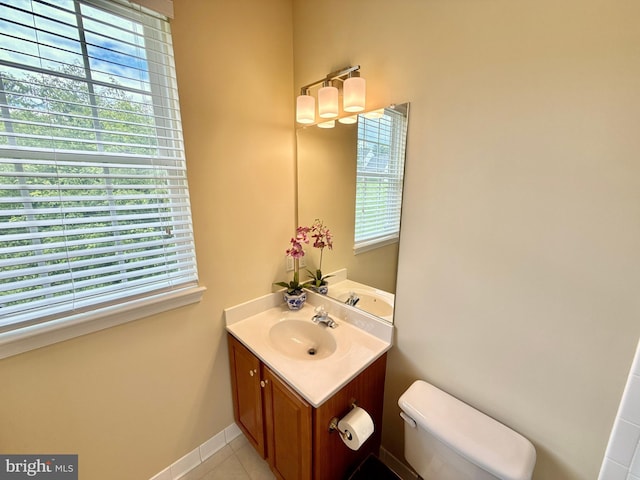 14100 Twisting Ln, Dayton, MD 21036 - bathroom featuring vanity, plenty of natural light, toilet, and tile patterned flooring