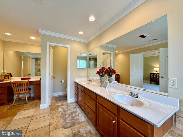 14100 Twisting Ln, Dayton, MD 21036 - bathroom with double vanity, crown molding, toilet, recessed lighting, and baseboards