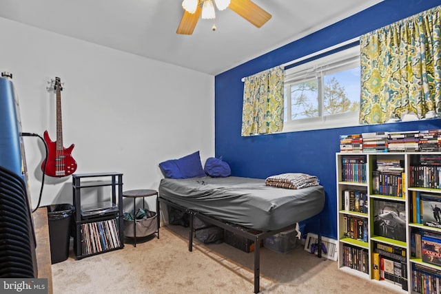 carpeted bedroom featuring a ceiling fan
