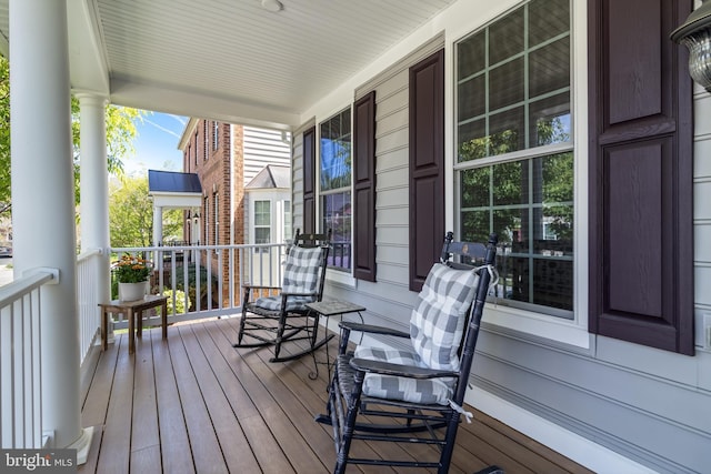 wooden deck featuring covered porch