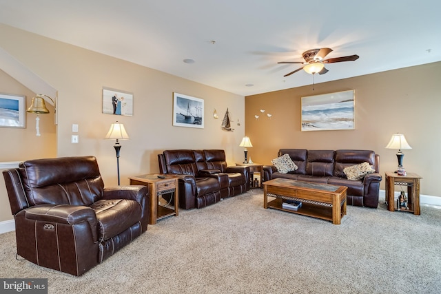 living room featuring carpet flooring, ceiling fan, and baseboards
