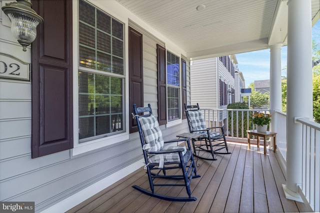 wooden terrace with a porch