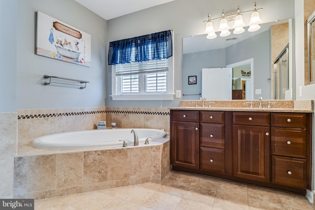 full bath with double vanity, a shower stall, a bath, and a sink
