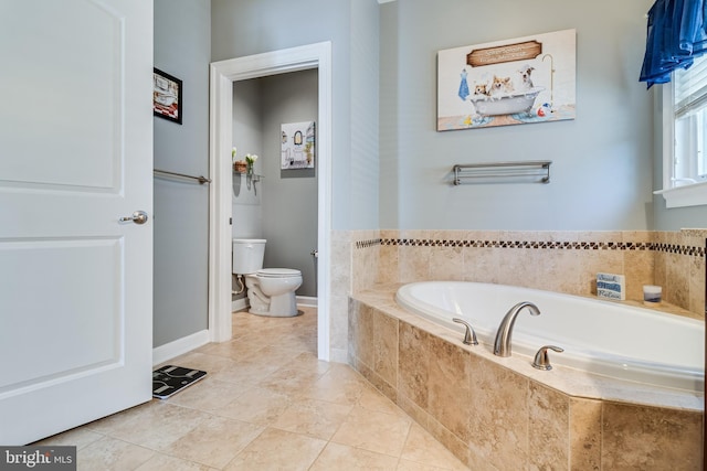 full bathroom with baseboards, toilet, tile patterned flooring, and a bath