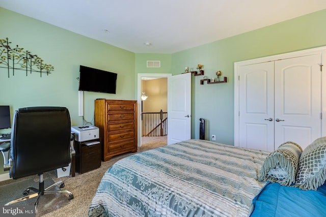 bedroom featuring visible vents, a closet, and carpet floors