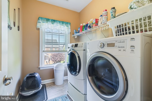 laundry room featuring separate washer and dryer, laundry area, and a healthy amount of sunlight