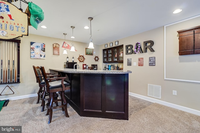 bar with visible vents, recessed lighting, indoor wet bar, and carpet flooring