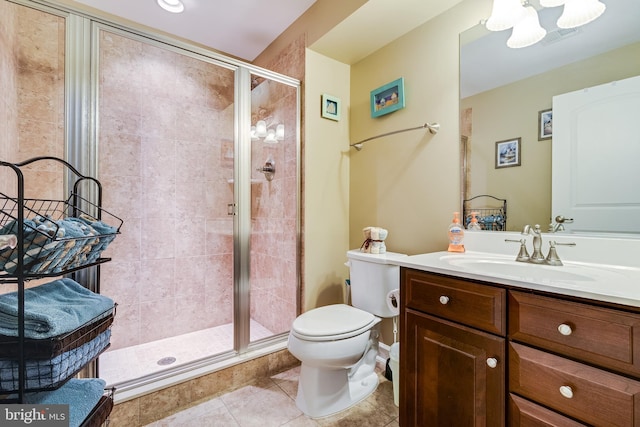 bathroom featuring visible vents, a stall shower, toilet, tile patterned floors, and vanity