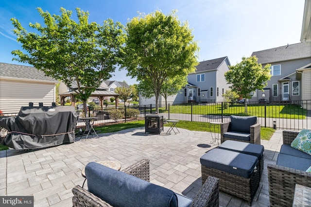 view of patio / terrace with a residential view, area for grilling, an outdoor hangout area, a gazebo, and fence