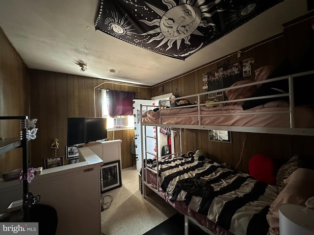 bedroom with wood walls