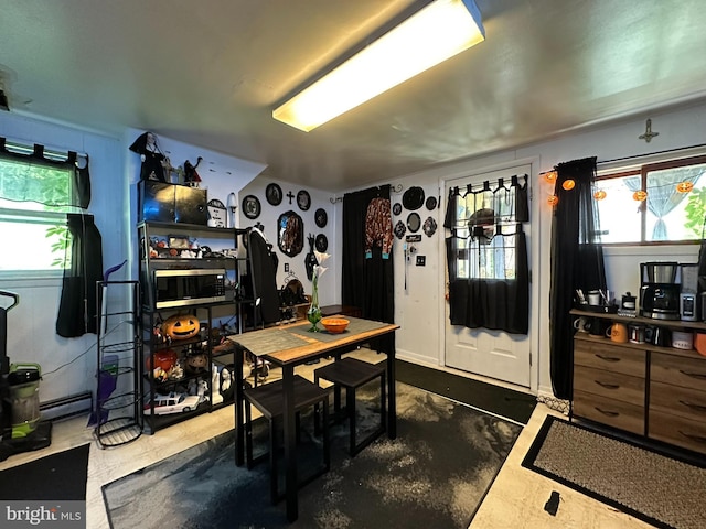 dining space featuring baseboard heating