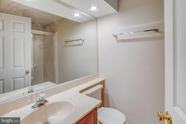 full bathroom with toilet, recessed lighting, a shower with shower door, and vanity