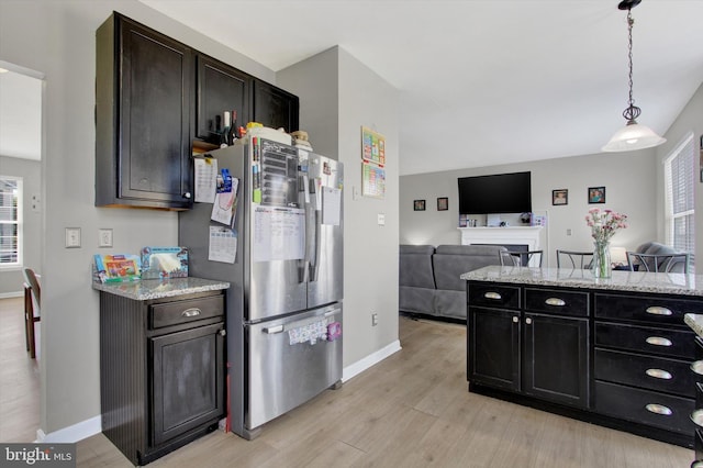 1425 Wanda Dr, Hanover, PA 17331 - kitchen featuring hanging light fixtures, light wood-type flooring, baseboards, freestanding refrigerator, and open floor plan