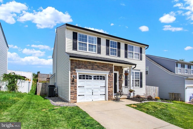 1425 Wanda Dr, Hanover, PA 17331 - traditional-style home featuring a front yard, fence, central AC unit, and stone siding