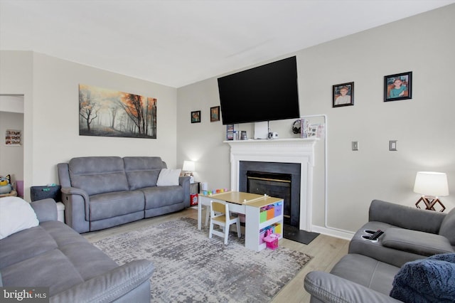 1425 Wanda Dr, Hanover, PA 17331 - living area with baseboards, a fireplace with flush hearth, and wood finished floors