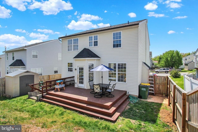 1425 Wanda Dr, Hanover, PA 17331 - back of house with a storage unit, a fenced backyard, and a deck