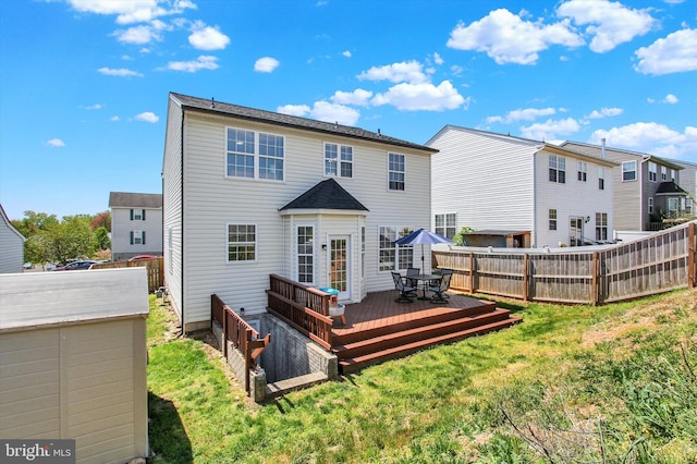 1425 Wanda Dr, Hanover, PA 17331 - rear view of property with outdoor dining area, a lawn, a deck, a fenced backyard, and a storage unit