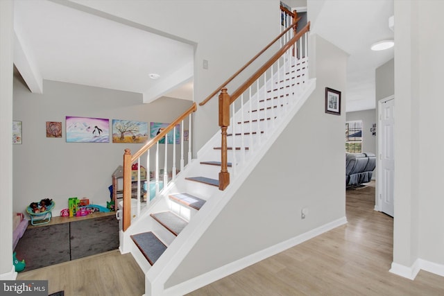 1425 Wanda Dr, Hanover, PA 17331 - stairs featuring baseboards, wood finished floors, and beam ceiling