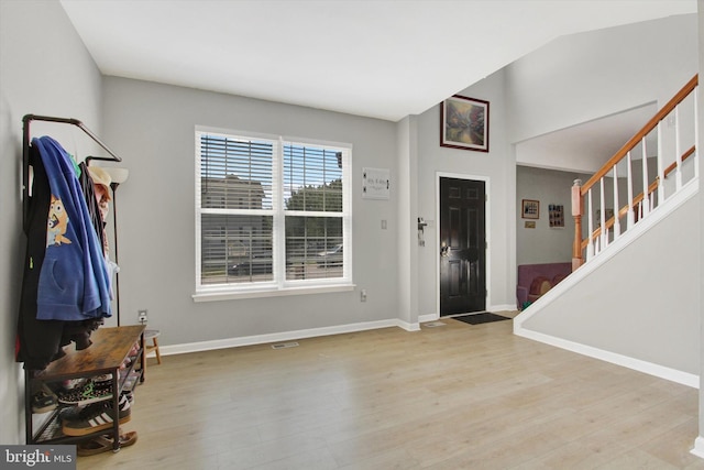 1425 Wanda Dr, Hanover, PA 17331 - entrance foyer featuring baseboards, wood finished floors, vaulted ceiling, and stairway