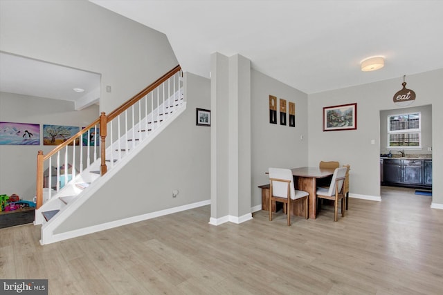 1425 Wanda Dr, Hanover, PA 17331 - dining space featuring light wood-style floors, baseboards, and stairway