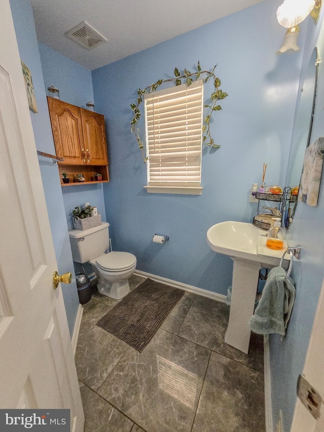 17616 Chisholm Ln, Dumfries, VA 22026 - half bathroom with toilet and baseboards