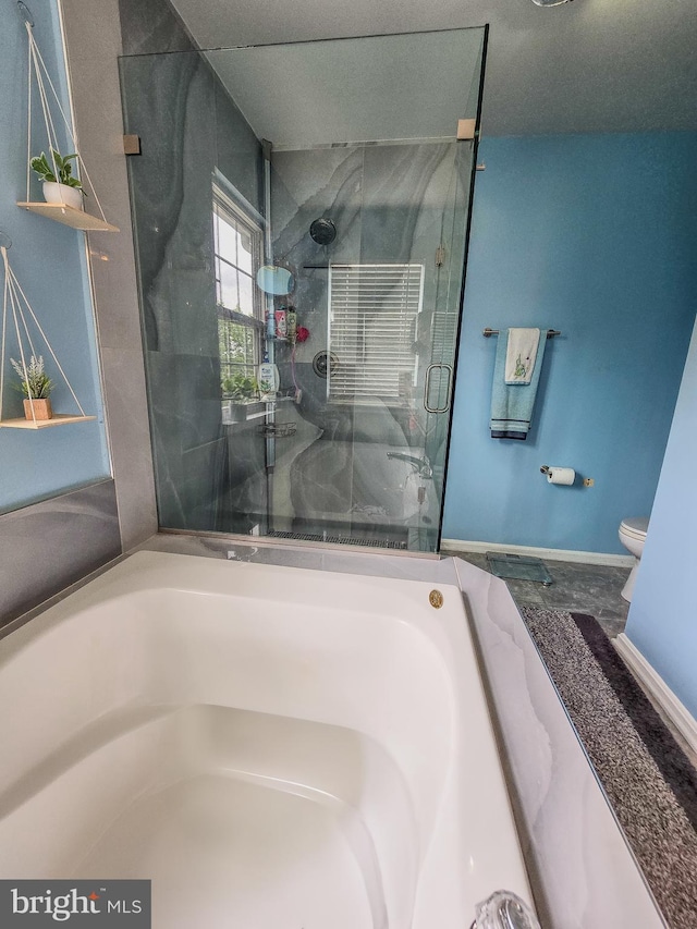 17616 Chisholm Ln, Dumfries, VA 22026 - full bathroom with a stall shower, toilet, and a garden tub