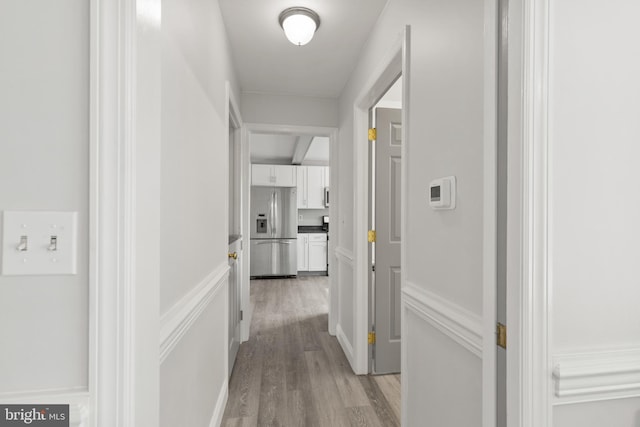corridor featuring light wood-style floors