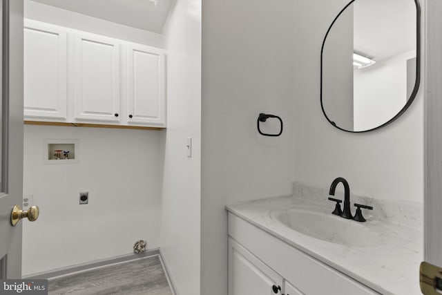 bathroom with vanity and wood finished floors