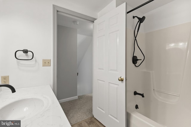 bathroom featuring a sink and tub / shower combination