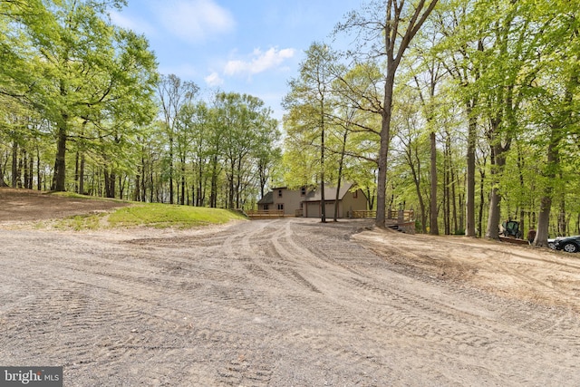 view of street featuring dirt driveway