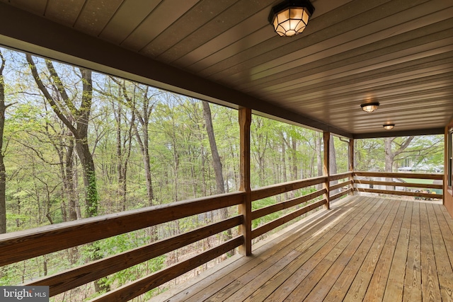 deck featuring a wooded view
