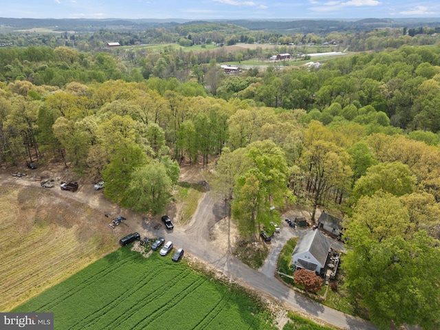 aerial view featuring a wooded view