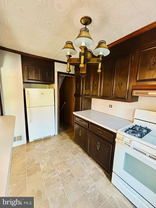 2633 Levick St, Philadelphia, PA 19149 - kitchen with light countertops, visible vents, ornamental molding, white appliances, and dark brown cabinetry